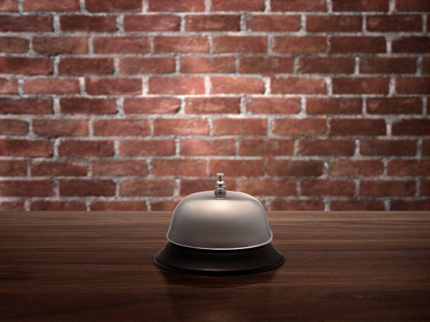 istock Hotel service bell on wood counter red brick wall background 1359302454
