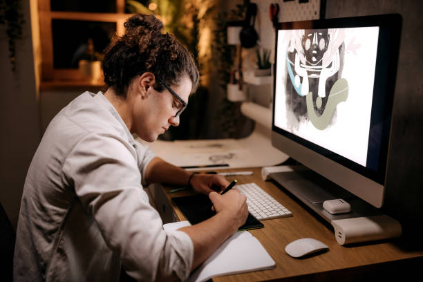 istock Young designer working late from home 1359302691