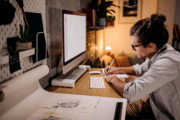 istock Young handsome businessman working late from home office 1359302828