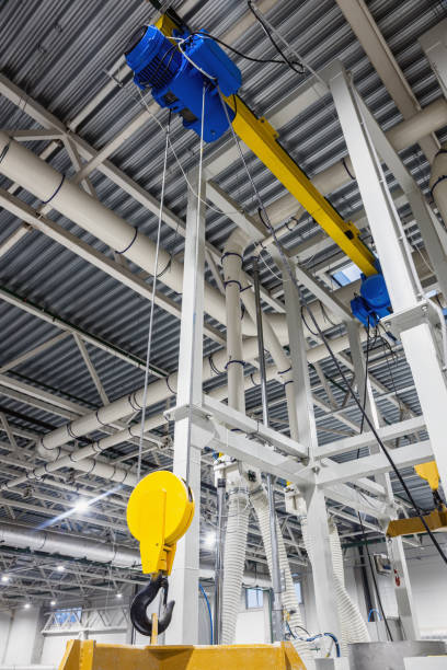 istock Crane hook inside factory building, industrial background 1359303699