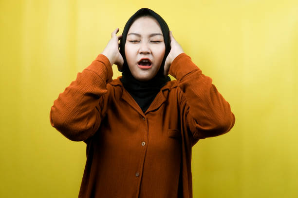 istock Beautiful young asian muslim woman shocked, dizzy, stressed, unhappy, many problems, want solution, with hands holding head isolated 1359303758