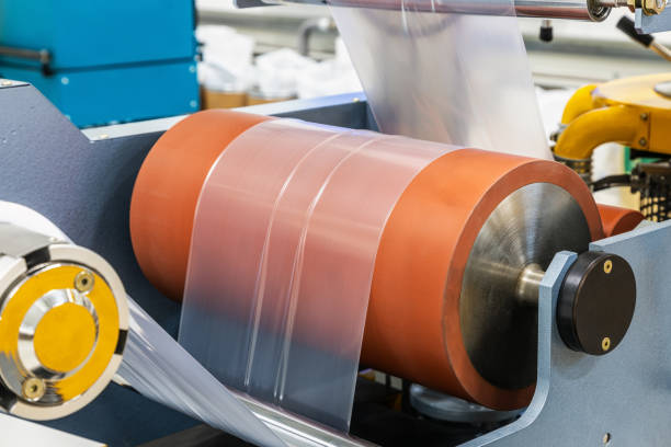 istock machine with roll of newly produced transparent plastic film 1359303828