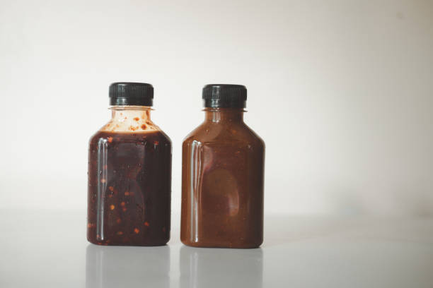 Two styles of Thai spicy sauce in a plastic bottle, Thai food ingredients, Thai spicy food.