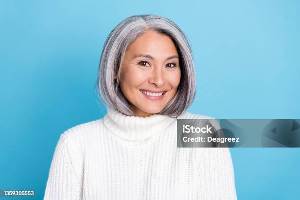Photo Of Senior Pretty Woman Good Mood Toothy Smile Oral Care Clinic Isolated Over Blue Color Background Stock Photo - Download Image Now