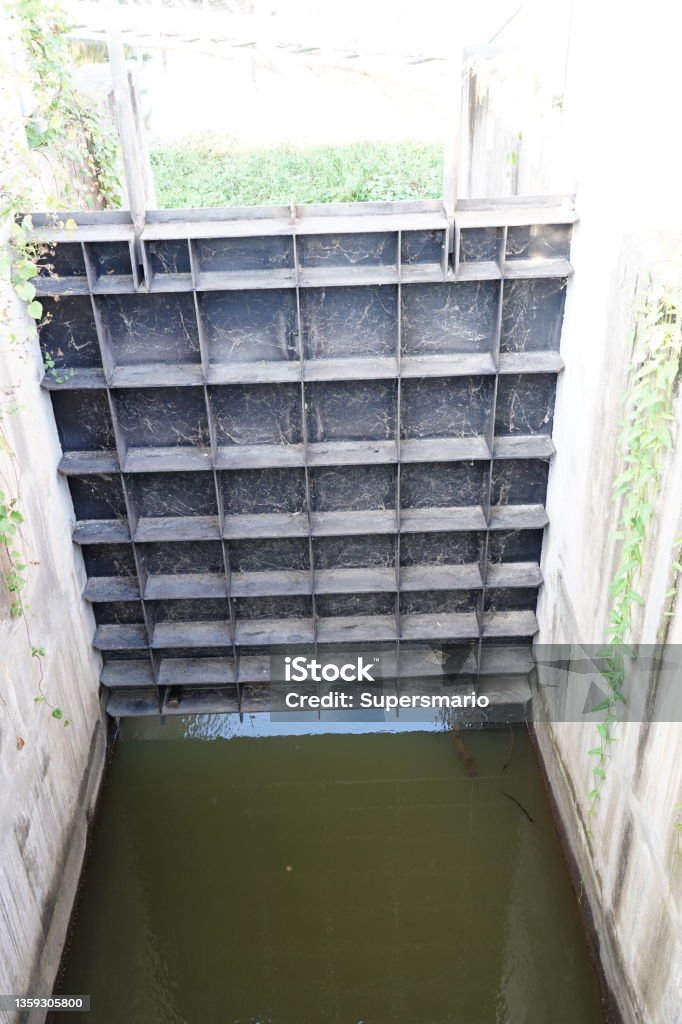 Watergate for water managements Watergate that has been left open to drain Accidents and Disasters Stock Photo
