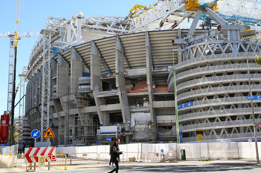 Madrid, Spain - November 17, 2021: Stadium of Real Madrid in the center of the city city - San Bernabeu is in reconstruction. Preparation for the deployment of the closing roof in Madrid on November 17, 2021
