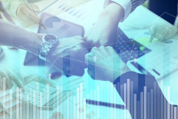 Three people working together, business cooperation, managing and running a profitable and growing business, chart graphics showing financial status and performance. Business administration concept.