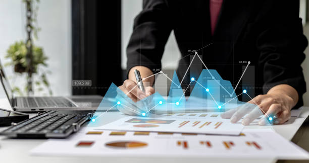 istock A businesswoman examines data on financial documents, company financial reports, graphics showing financial and numerical growth data. The concept of financial management to grow and be profitable. 1359307276