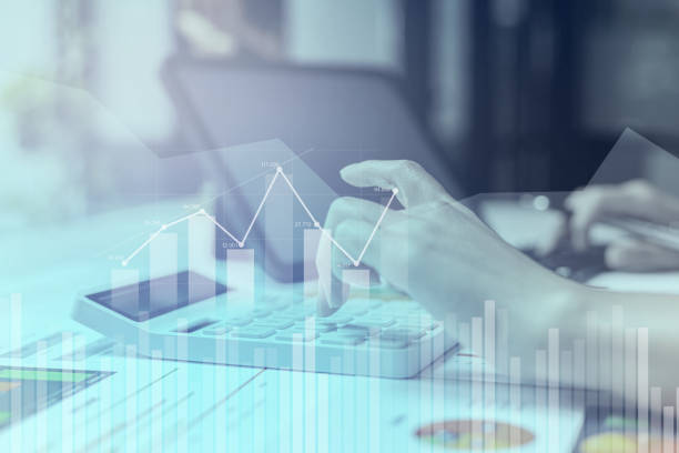 istock Businesswoman presses a calculator to check data on documents, company financial reports, graphics showing financial and numerical growth data. Financial management to grow and be a profitable concept 1359307337