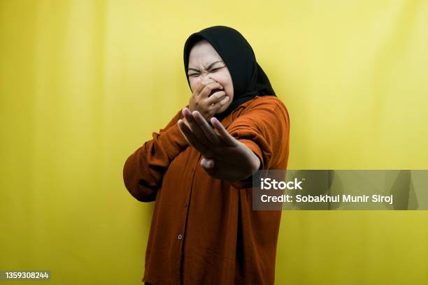 Beautiful Young Asian Muslim Woman With Hand Covering Mouth Refusing Something Isolated Stock Photo - Download Image Now