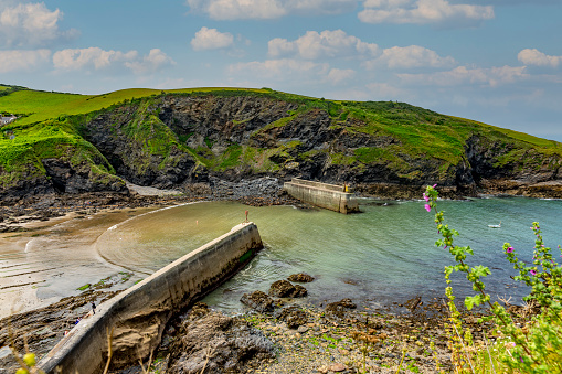 The Cornish coast at the entrance to Port Isaac harbour.  Port Isaac is the location for the fictional Port Wen in the TV series 'Doc Martin'.