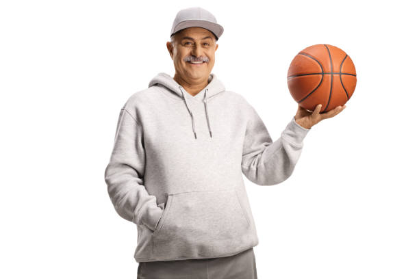 istock Smiling mature man holding a basketball 1359309703