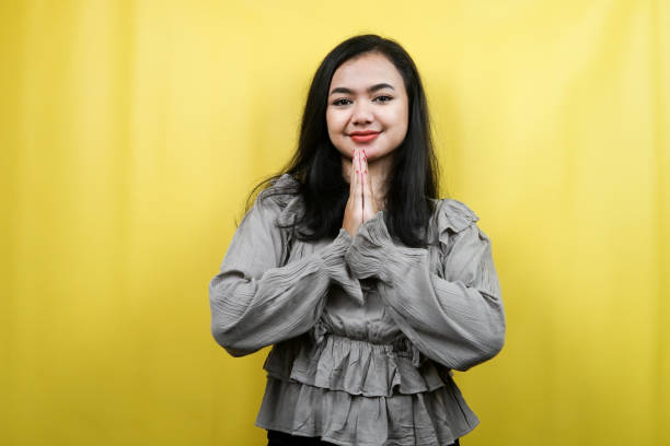 istock Beautiful young woman cheerful, confident, hands down, apologizing, isolated 1359311995