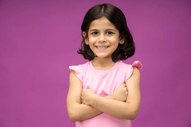 милая маленькая индийская девочка, фото фонда - little girls pre adolescent child standing isolated стоковые фото и изображения