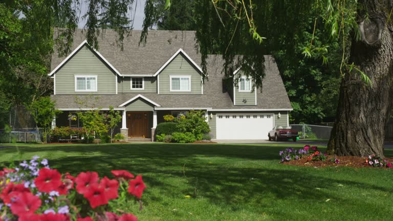 Family home with spring flowers, dolly movement