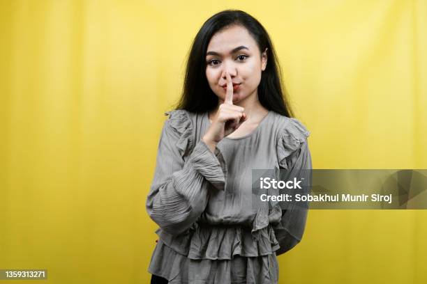 Beautiful Young Woman With Hands Shh Shhh Hands On Mouth Dont Make Noise Please Be Quiet Isolated Stock Photo - Download Image Now