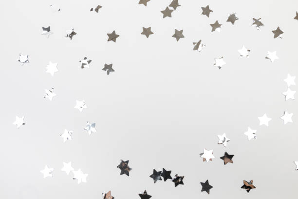 istock star silver confetti on white background flat lay text place - Image 1359317942