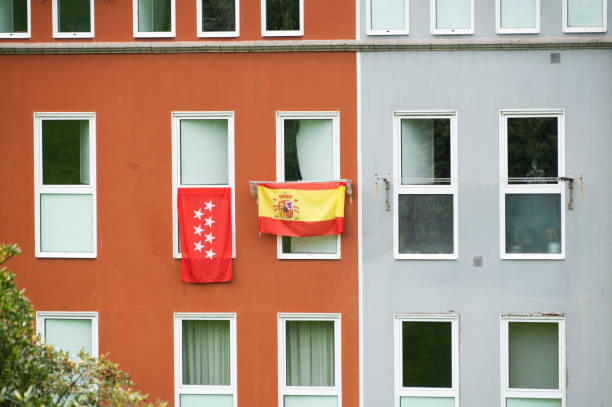 istock Spanish and Madrid's flags on an apartment building facade 1359318920