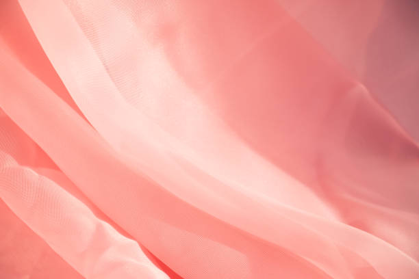 istock Pink transparent fabric close-up. Texture. Abstract design 1359319025