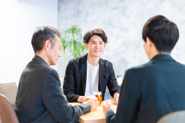 istock Salaryman drinking beer at beer bar 1359320647