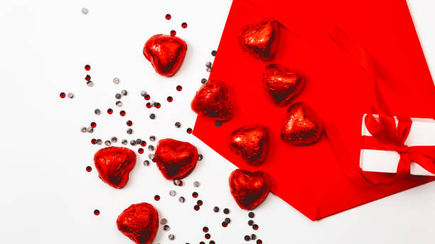 istock Valentines day love letter. opened envelope and many felt red hearts. Copy space 1359322404