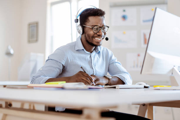istock Male Call Center Agent or Telemarketer Work Consult Client Online 1359326650
