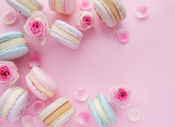 istock Tasty macaroons with beautiful roses 1359326719