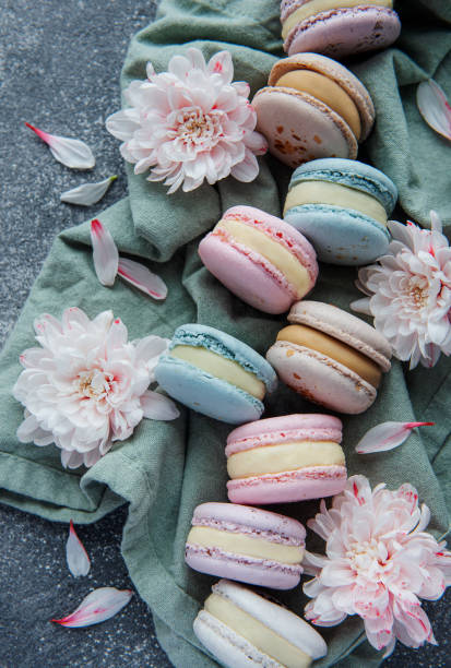istock Beautiful colorful tasty macaroons on a concrete background 1359326722