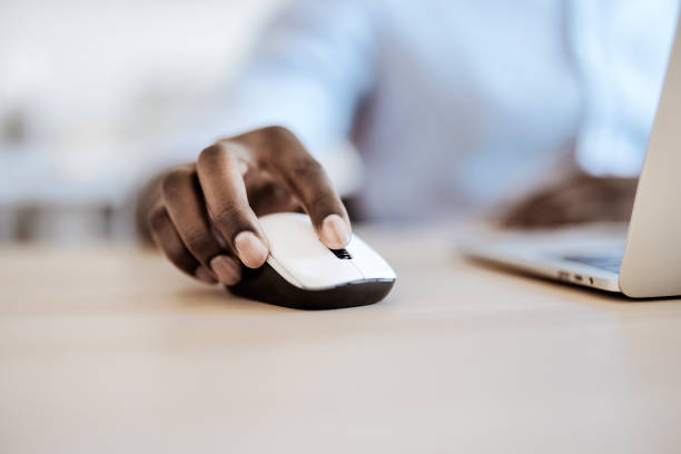 istock Close up of a business man hand using computer mouse 1359327367