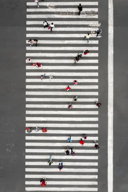Aerial view of a crowd crossing the street
