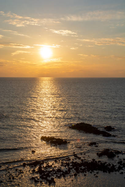 istock The sea at sunset reflecting the sunlight 1359333459