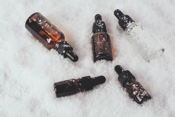 istock Glass bottles for serum in the snow 1359335357
