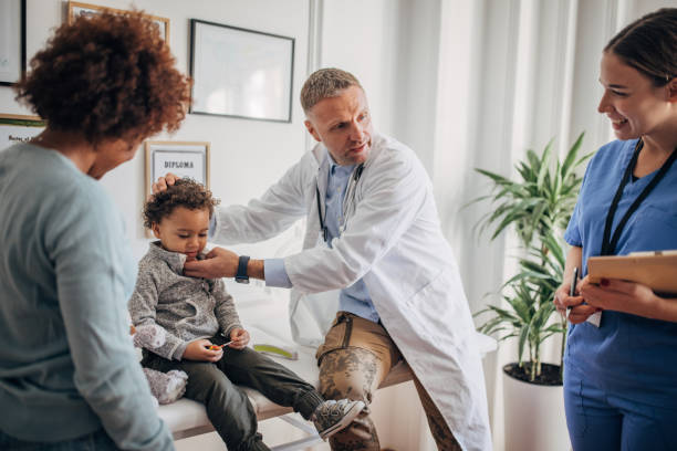 istock Little boy at the pediatrician 1359337069