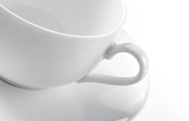 Empty white tea cup and saucer stock photo