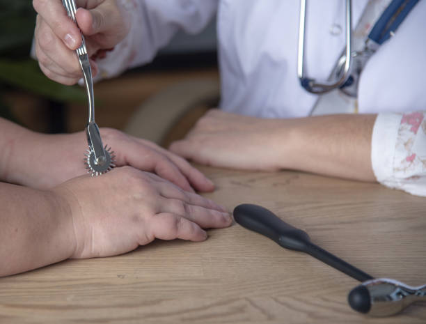 istock The doctor checks the pain sensitivity with the Wartenberg wheel . 1359338607