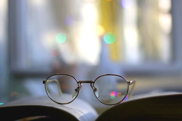 istock Book, Glasses and Colorful Bokeh 1359339822