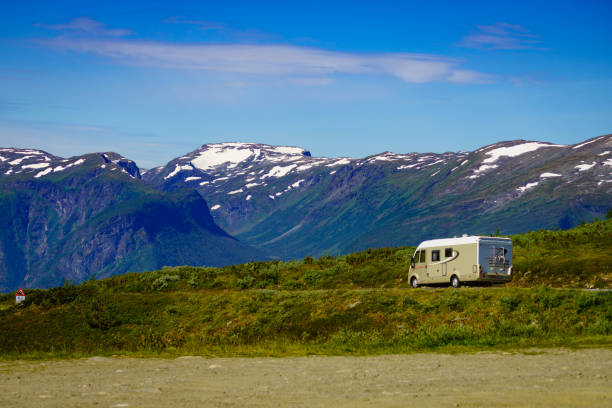 istock Camper car on road in norwegian mountains 1359340729