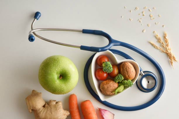 istock Healthcare concept with healthy products and tools on white table 1359340844