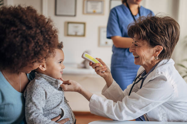 istock Doctor examining little boy 1359342214