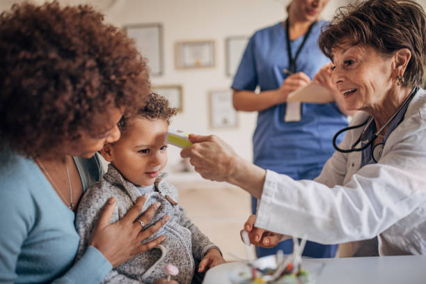istock Doctor examining little boy 1359342908