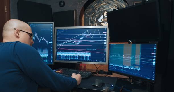 istock Man trader, freelancer on stock exchange trades options at home computer 1359344724