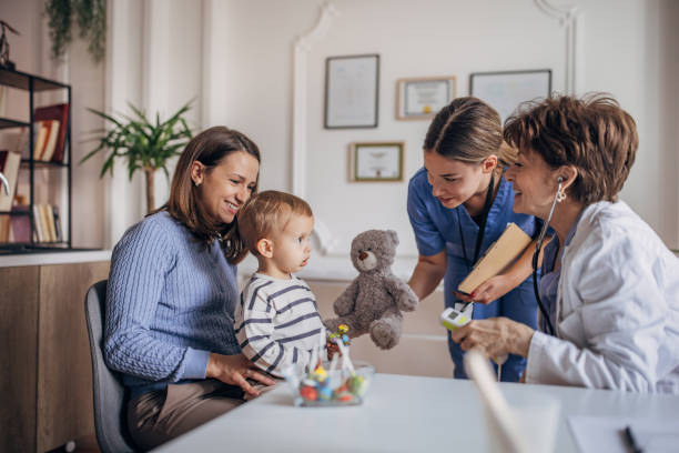istock Little boy at the pediatrician 1359346188