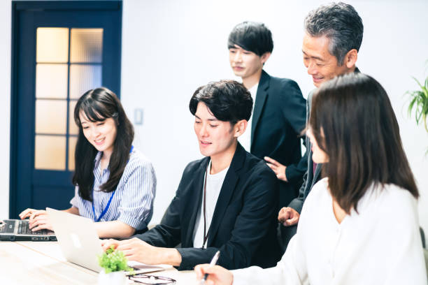 istock Office worker having a meeting in the office 1359348377