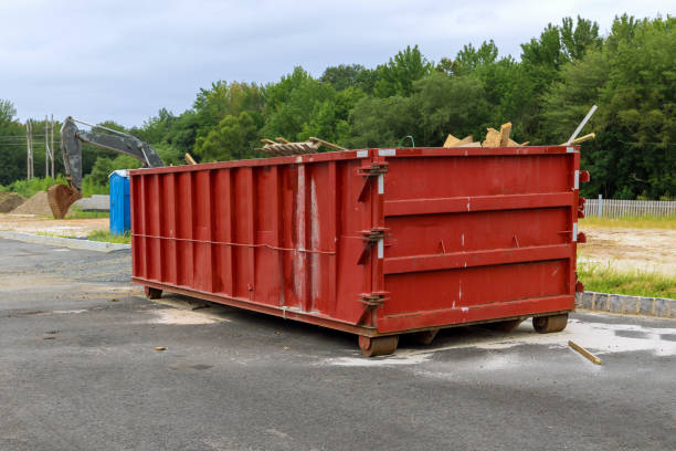 istock Home renovation maintenance a loaded dumpster near a construction 1359349224