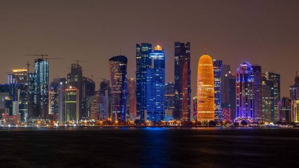 istock view of doha corniche during night along with fanar building. 1359349414