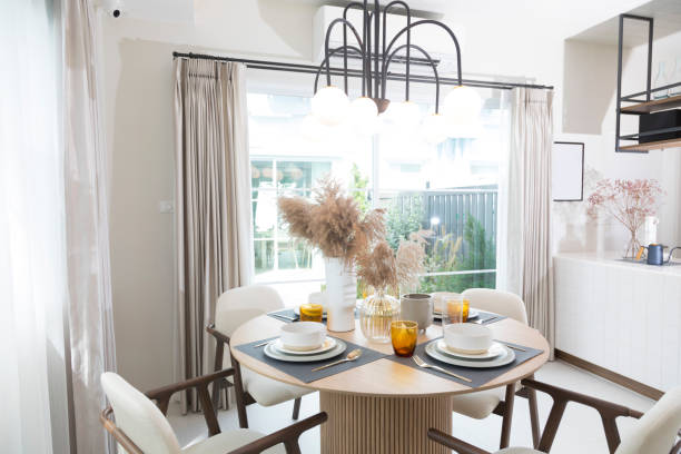 istock Table set on round table in modern style dining room interior of modern home. 1359350780