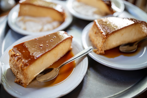 Close-up of slices of Argentinian flan tart serving tray. Dessert ready to serve at the restaurant.