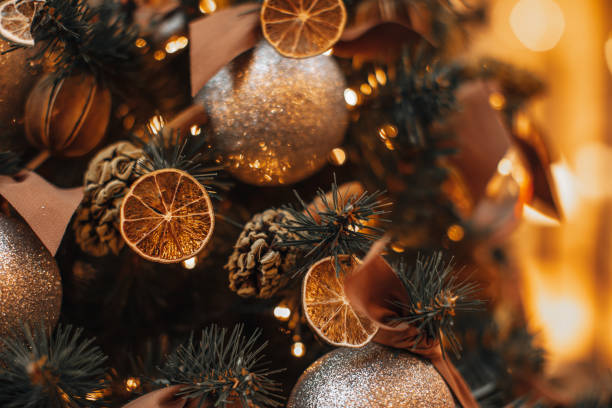 istock Christmas tree branches decorated with dried oranges, mandarins and pine cones. 1359351232