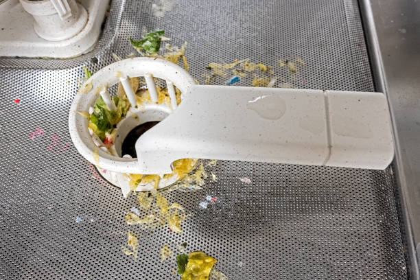 Cutlery in a dishwasher basket emphasize the importance of safety with downward pointing tips.