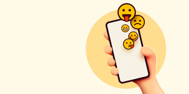 istock Hand holding phone emoticons. Social media and messenger chatting. 1359357067